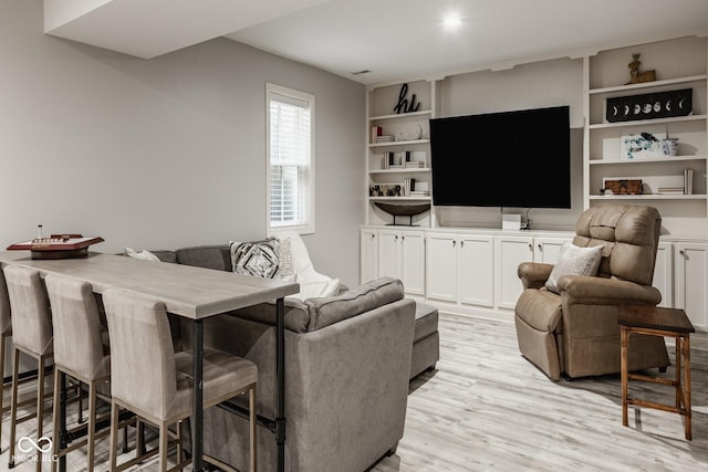 12505 Branford St, Carmel, IN 46032 - living room with light wood finished floors and built in features