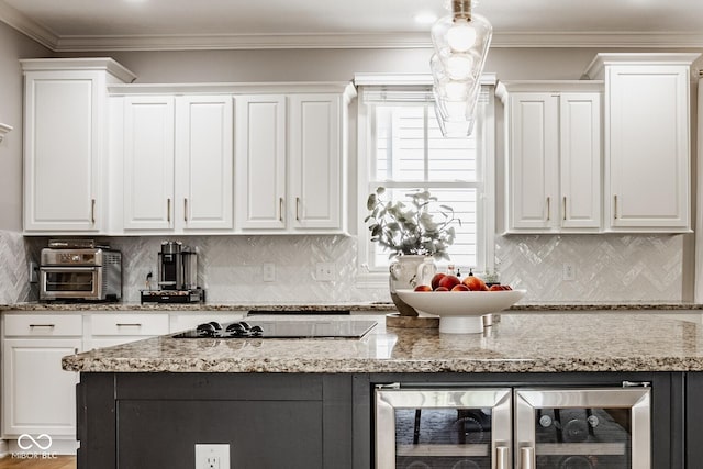 12505 Branford St, Carmel, IN 46032 - kitchen featuring black electric cooktop, white cabinets, wine cooler, and ornamental molding