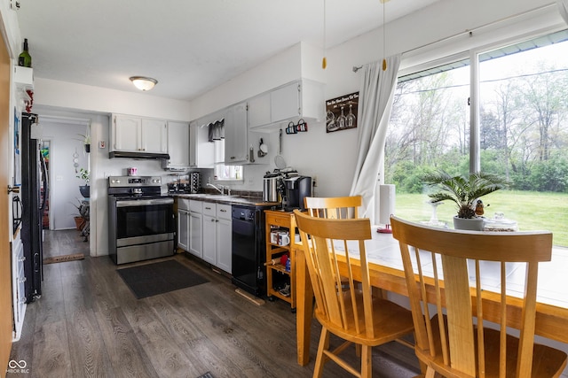 1207 E Main St, Centerville, IN 47330 - kitchen with stainless steel electric range, dishwasher, under cabinet range hood, dark wood-style floors, and dark countertops