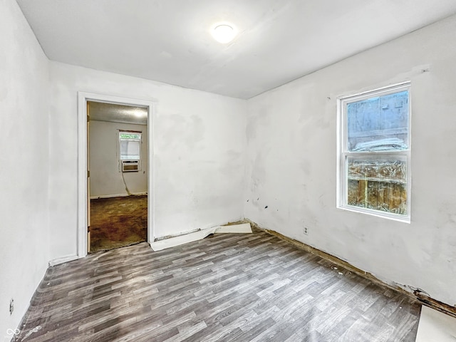 3422 Hillside Ave, Indianapolis, IN 46218 - spare room with wood finished floors and cooling unit