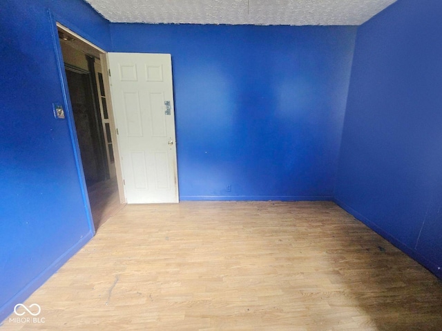 5156 N 14th St, Terre Haute, IN 47805 - unfurnished room with wood finished floors and a textured ceiling