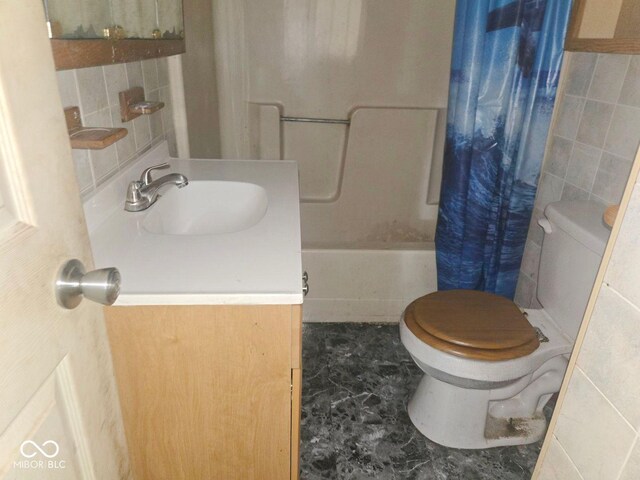 5156 N 14th St, Terre Haute, IN 47805 - bathroom with tile walls, vanity, and shower / bath combo with shower curtain