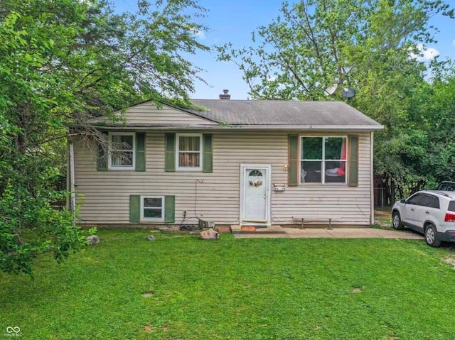 5614 Regency Dr, Indianapolis, IN 46224 - view of front facade featuring a front yard and a chimney