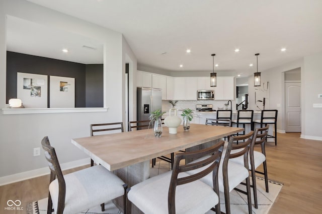 6842 Jacone Dr, Brownsburg, IN 46112 - dining area featuring light wood finished floors and recessed lighting