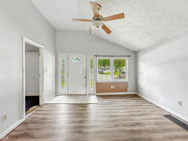 3251 Mars Hill St, Indianapolis, IN 46221 - entryway featuring vaulted ceiling, ceiling fan, and wood finished floors