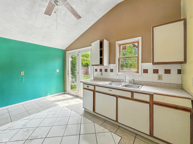 3251 Mars Hill St, Indianapolis, IN 46221 - kitchen featuring vaulted ceiling, a textured ceiling, light countertops, light tile patterned floors, and a ceiling fan