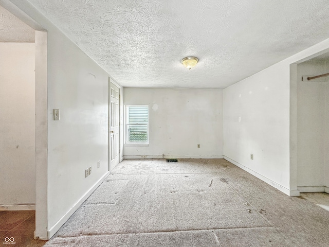 3251 Mars Hill St, Indianapolis, IN 46221 - empty room featuring a textured ceiling and baseboards