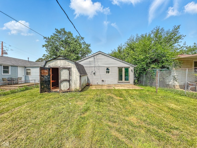 3251 Mars Hill St, Indianapolis, IN 46221 - rear view of property with a storage shed, a fenced backyard, and a patio