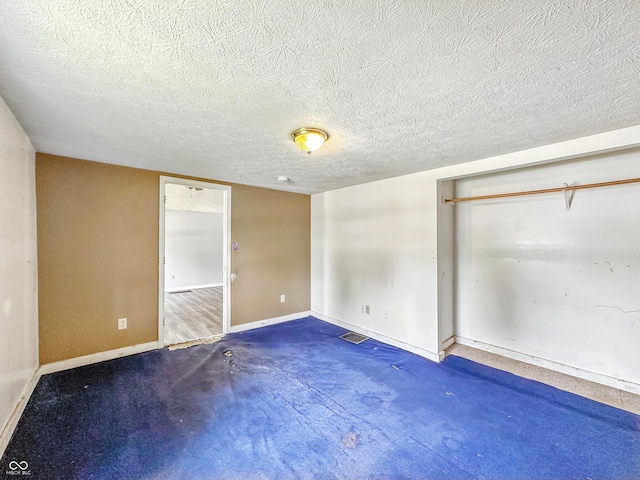 3251 Mars Hill St, Indianapolis, IN 46221 - unfurnished bedroom featuring a closet and a textured ceiling
