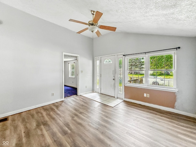 3251 Mars Hill St, Indianapolis, IN 46221 - foyer entrance featuring wood finished floors, ceiling fan, and vaulted ceiling
