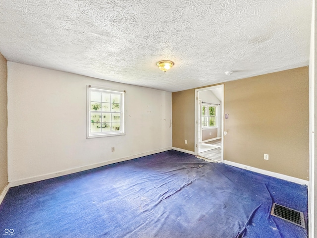 3251 Mars Hill St, Indianapolis, IN 46221 - carpeted spare room with a textured ceiling and a smoke detector