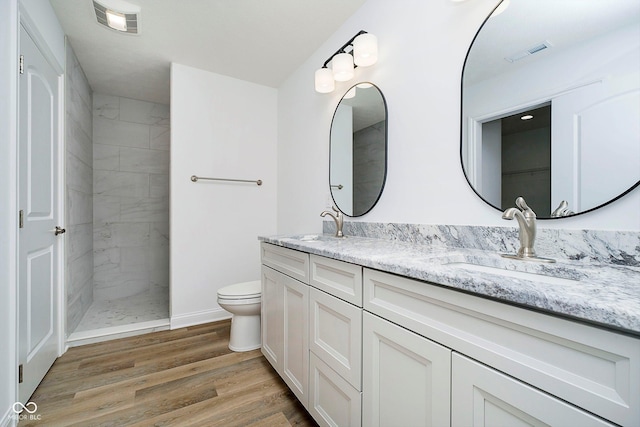 202 Asbury Dr, Anderson, IN 46013 - full bath with double vanity, wood finished floors, and a walk in shower