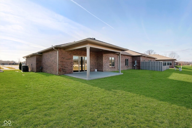 202 Asbury Dr, Anderson, IN 46013 - back of property featuring a patio area and brick siding