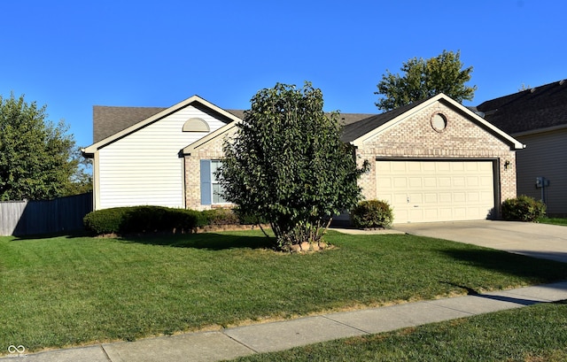 1896 Central Park Blvd W, Greenwood, IN 46143 - view of front of home with brick siding, an attached garage, concrete driveway, and a shingled roof