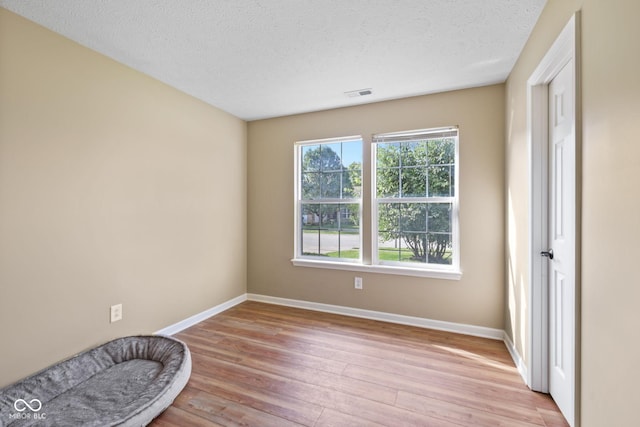 1896 Central Park Blvd W, Greenwood, IN 46143 - empty room with light wood finished floors and a textured ceiling