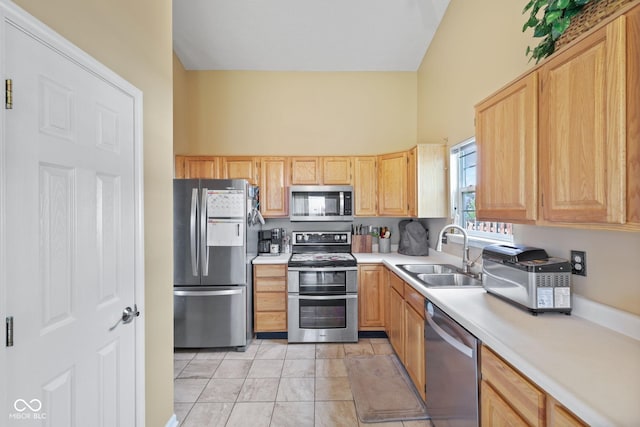 1896 Central Park Blvd W, Greenwood, IN 46143 - kitchen featuring stainless steel appliances, light brown cabinets, light countertops, and light tile patterned flooring