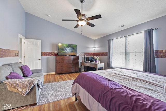 1896 Central Park Blvd W, Greenwood, IN 46143 - bedroom featuring vaulted ceiling, wood finished floors, and a ceiling fan