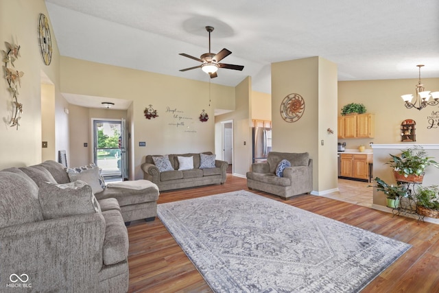 1896 Central Park Blvd W, Greenwood, IN 46143 - living room with light wood-type flooring, a chandelier, a ceiling fan, and high vaulted ceiling