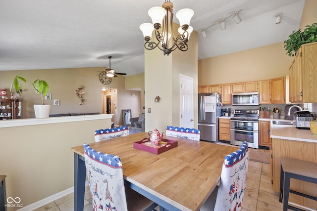 1896 Central Park Blvd W, Greenwood, IN 46143 - dining area with light tile patterned floors, ceiling fan, a chandelier, and high vaulted ceiling