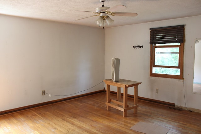 515 Hawthorne Ave, Anderson, IN 46011 - unfurnished room featuring ceiling fan, light wood-style flooring, and a textured ceiling