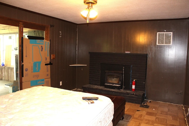 515 Hawthorne Ave, Anderson, IN 46011 - bedroom featuring wooden walls, crown molding, and a textured ceiling