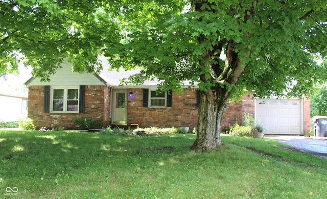 515 Hawthorne Ave, Anderson, IN 46011 - view of front of home with driveway, a front lawn, and brick siding