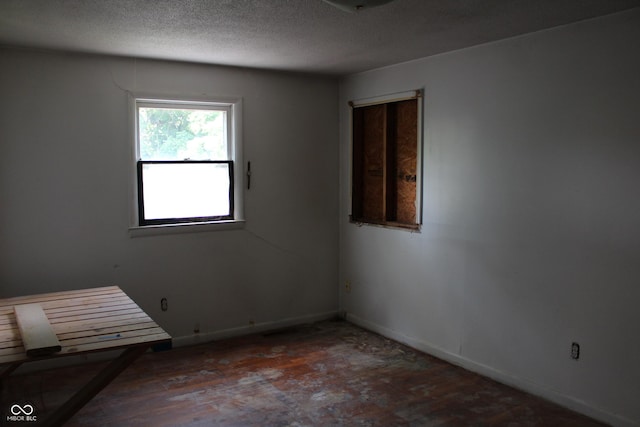 515 Hawthorne Ave, Anderson, IN 46011 - empty room featuring a textured ceiling and wood finished floors