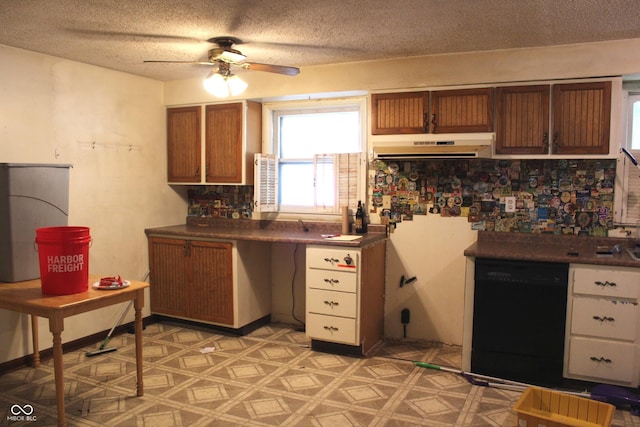 515 Hawthorne Ave, Anderson, IN 46011 - kitchen featuring black dishwasher, under cabinet range hood, ceiling fan, a textured ceiling, and dark countertops