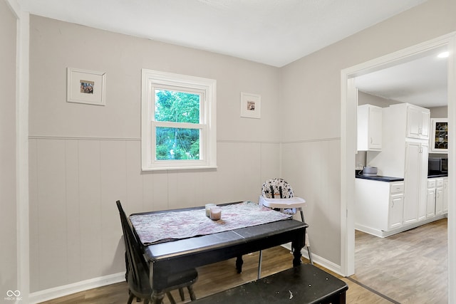 818 Vasbinder Dr, Chesterfield, IN 46017 - dining room featuring light wood-style flooring and wainscoting