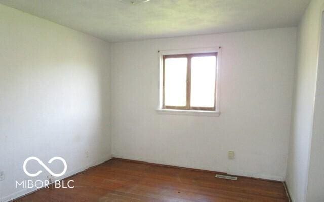 311 Fall Creek Dr, Anderson, IN 46013 - empty room featuring wood finished floors