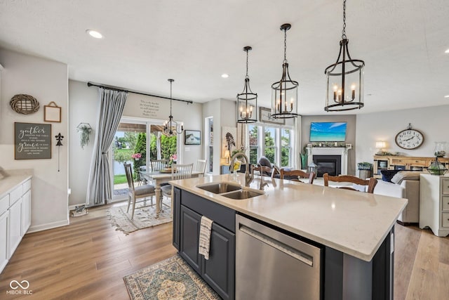 19281 Scofield Ridge Blvd, Westfield, IN 46074 - kitchen featuring dishwasher, a chandelier, open floor plan, recessed lighting, and light wood-style flooring
