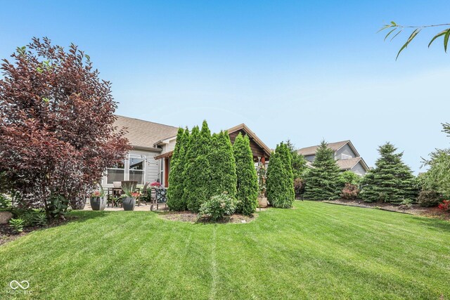 19281 Scofield Ridge Blvd, Westfield, IN 46074 - view of grassy yard with a patio