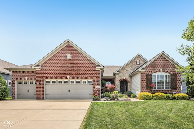 19281 Scofield Ridge Blvd, Westfield, IN 46074 - traditional-style house featuring brick siding, an attached garage, driveway, a front yard, and roof with shingles