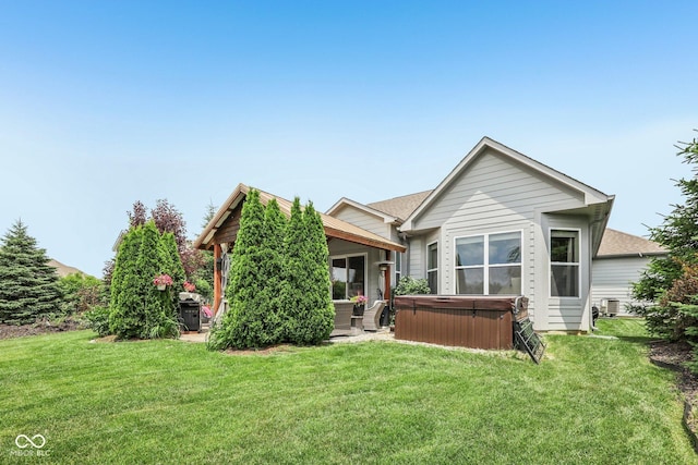 19281 Scofield Ridge Blvd, Westfield, IN 46074 - rear view of property with a hot tub and a yard