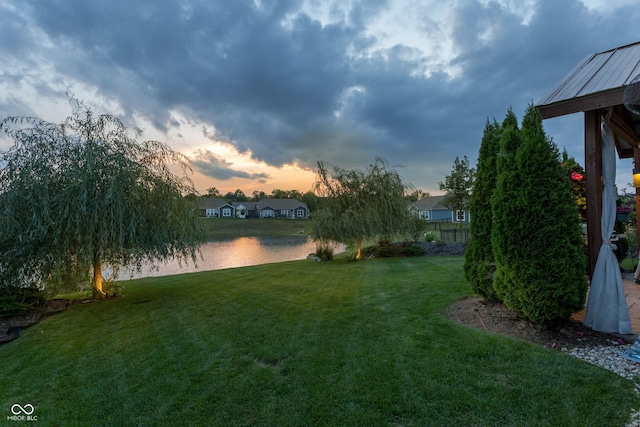 19281 Scofield Ridge Blvd, Westfield, IN 46074 - yard at dusk with a yard and a water view