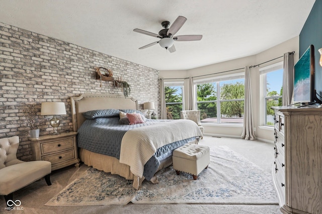 19281 Scofield Ridge Blvd, Westfield, IN 46074 - carpeted bedroom featuring brick wall, a textured ceiling, and ceiling fan