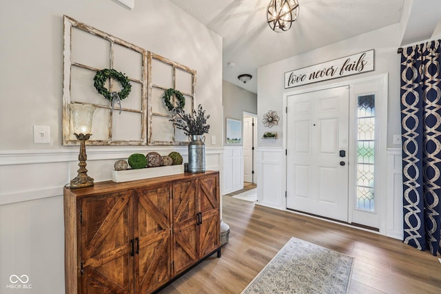 19281 Scofield Ridge Blvd, Westfield, IN 46074 - foyer entrance featuring a decorative wall, a wainscoted wall, and wood finished floors