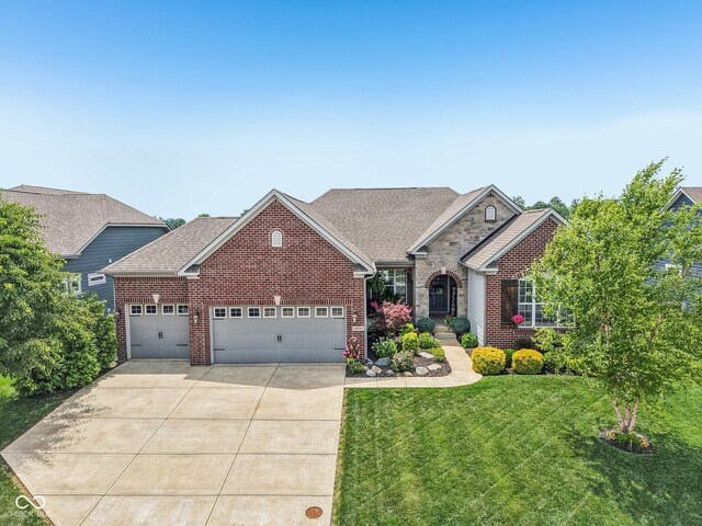 19281 Scofield Ridge Blvd, Westfield, IN 46074 - traditional home featuring brick siding, a garage, concrete driveway, and a front lawn