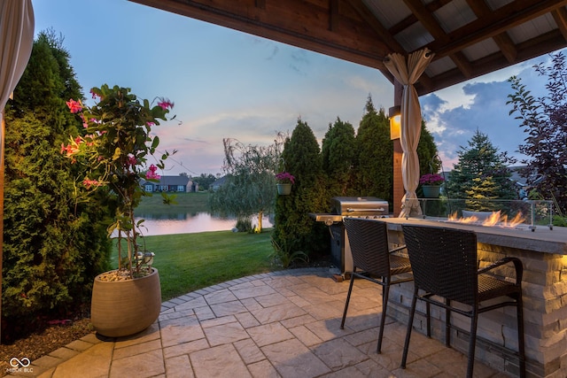 19281 Scofield Ridge Blvd, Westfield, IN 46074 - patio terrace at dusk featuring a water view, a yard, a patio area, and area for grilling
