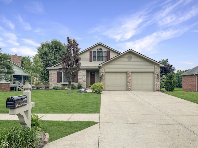 3287 Buckmoor Pkwy, Greenwood, IN 46143 - view of front facade with driveway, an attached garage, and a front yard