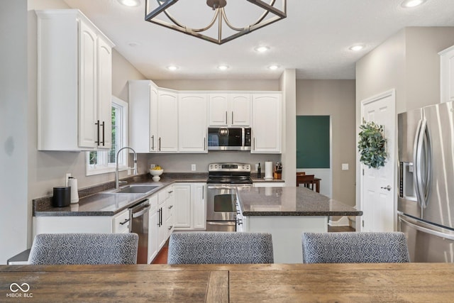 427 Quincy Pl, Westfield, IN 46074 - kitchen featuring stainless steel appliances, white cabinetry, and recessed lighting