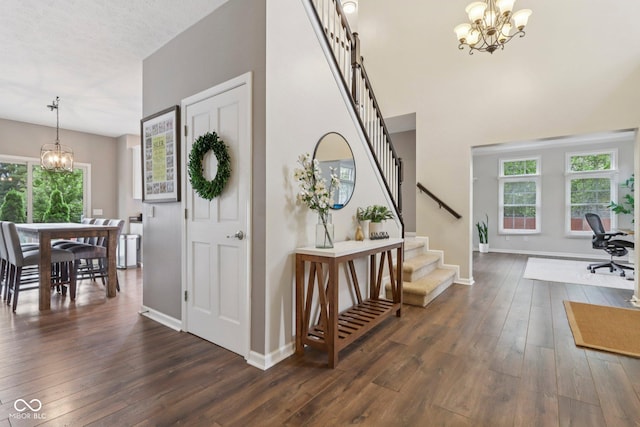 427 Quincy Pl, Westfield, IN 46074 - entryway featuring a chandelier, dark wood-type flooring, stairway, and healthy amount of natural light