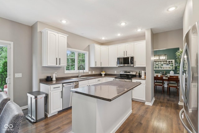 427 Quincy Pl, Westfield, IN 46074 - kitchen featuring appliances with stainless steel finishes, healthy amount of natural light, white cabinetry, dark wood finished floors, and recessed lighting