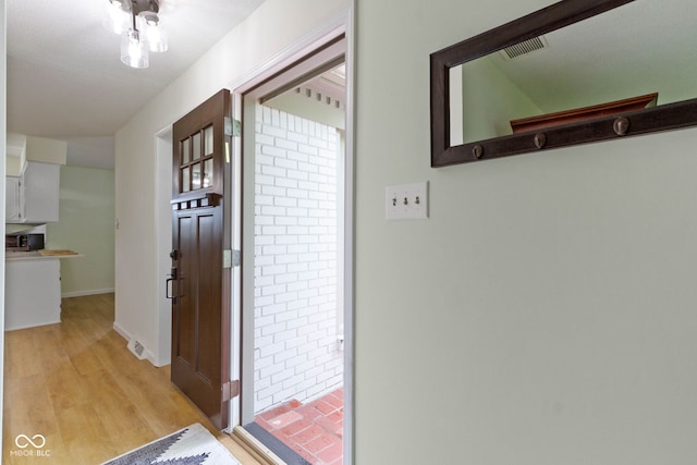 3841 Meridee Dr, Indianapolis, IN 46237 - foyer entrance with light wood finished floors and baseboards