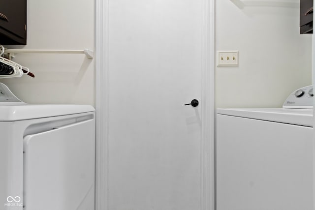3841 Meridee Dr, Indianapolis, IN 46237 - laundry area with washer and clothes dryer and cabinet space
