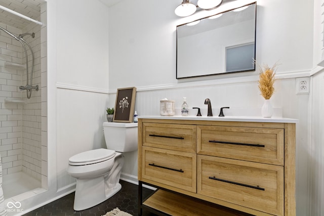 3841 Meridee Dr, Indianapolis, IN 46237 - full bathroom with vanity, a wainscoted wall, tiled shower, and tile patterned floors