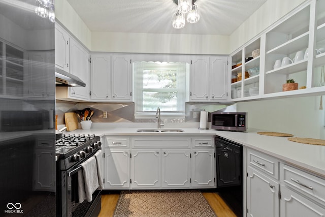 3841 Meridee Dr, Indianapolis, IN 46237 - kitchen featuring black appliances, under cabinet range hood, white cabinetry, and light countertops