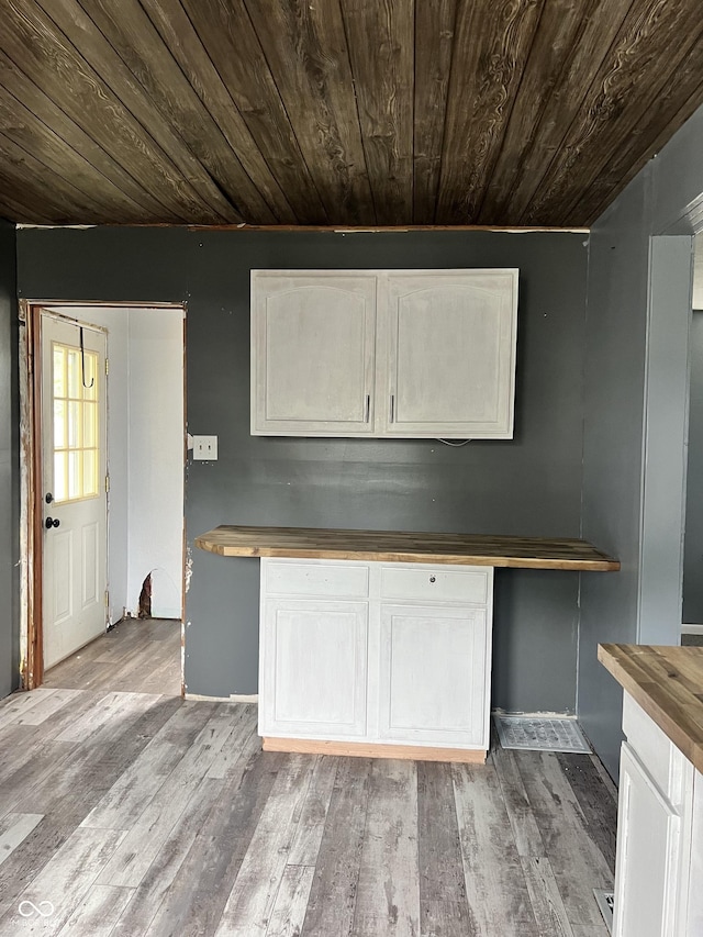2244 Lafayette St, Anderson, IN 46012 - kitchen featuring wooden ceiling, wood counters, white cabinets, and light wood-style floors