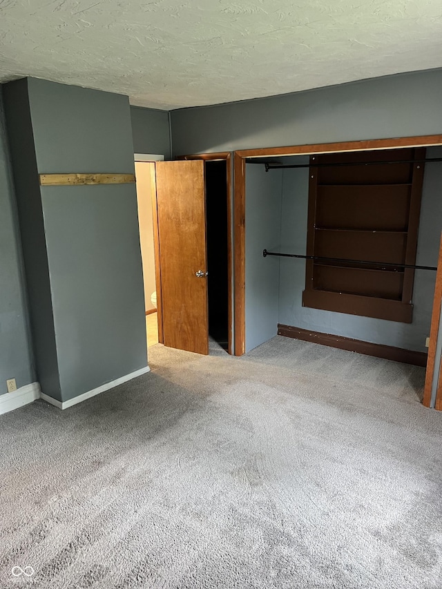 2244 Lafayette St, Anderson, IN 46012 - unfurnished bedroom featuring carpet floors and a textured ceiling