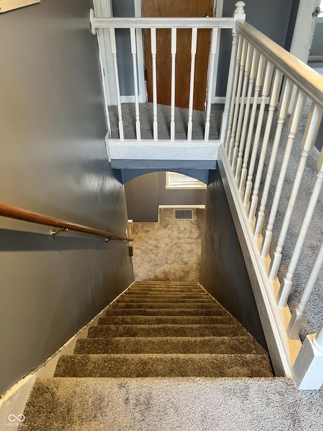 2244 Lafayette St, Anderson, IN 46012 - staircase with carpet floors